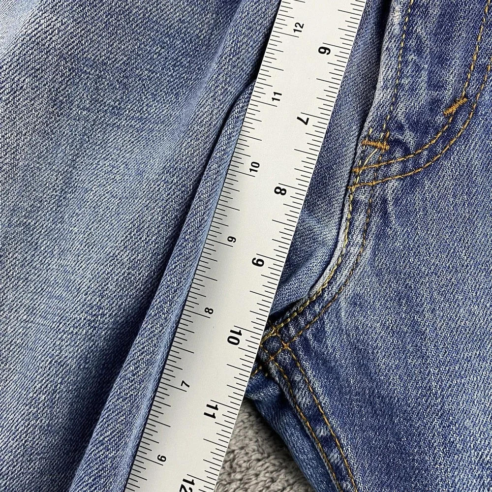 Levis 527 Low Boot Cut Jeans Mens 34x30 Blue Medium Wash Mid Rise Distressed Rip